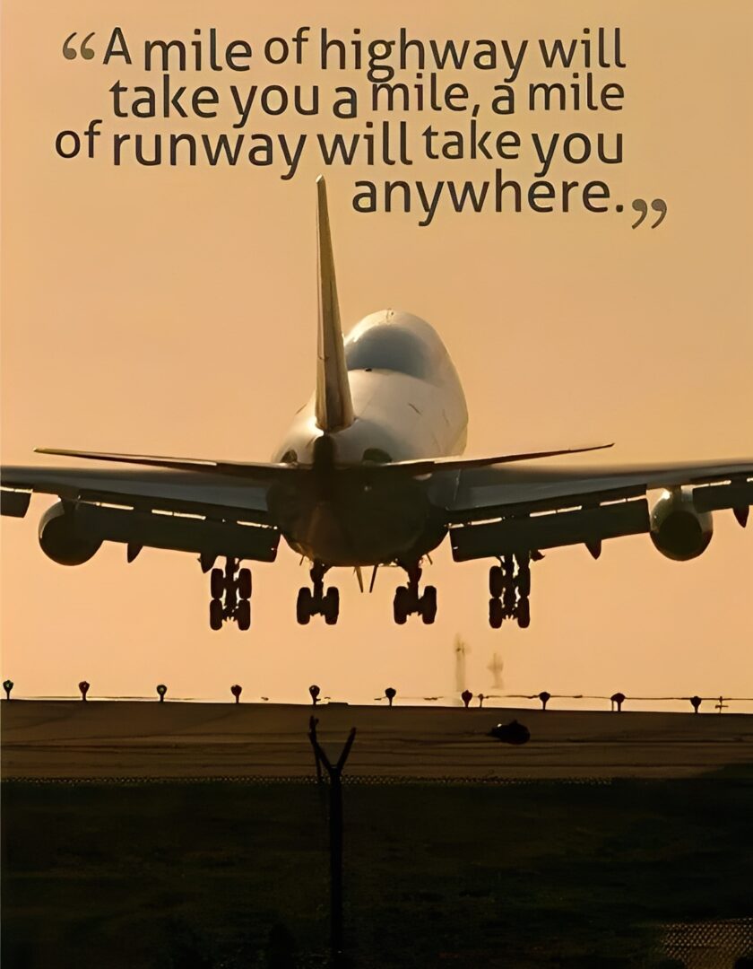 Airplane landing at sunset with inspirational quote